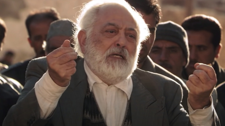 Vachik Mangassarian raising fists in The Stoning of Soraya M.