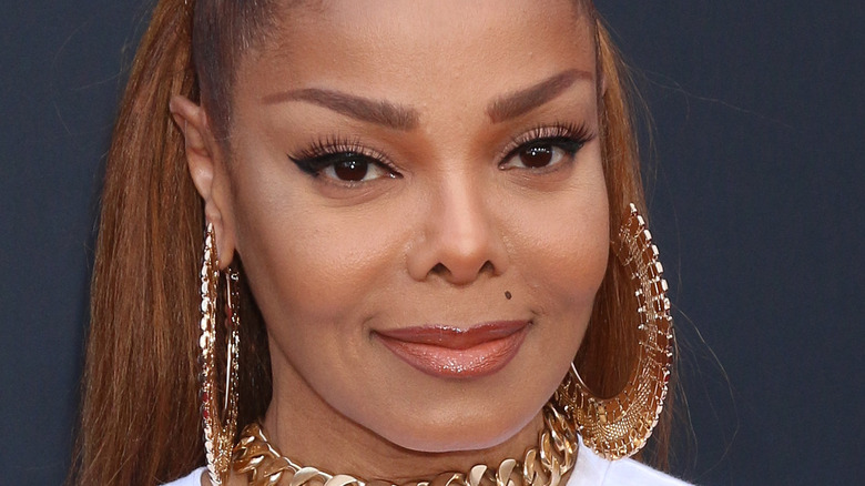 Janet Jackson wearing gold jewelry