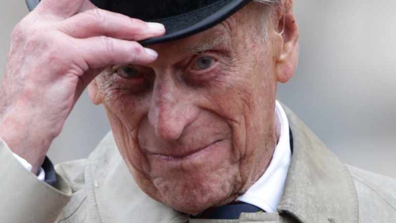 Prince Philip raising hat at event 