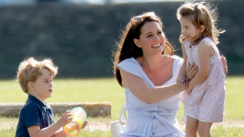 Kate Middleton playing with Prince George and Princess Charlotte
