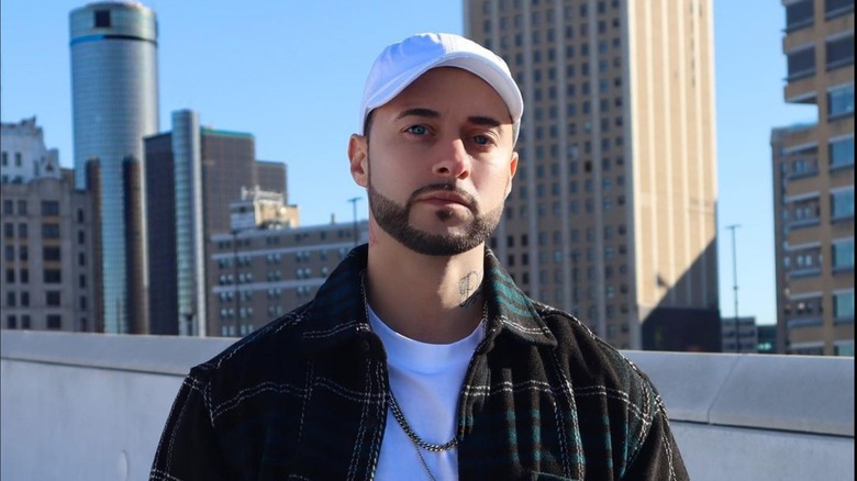 Nathan Kane Mathers smiling on rooftop