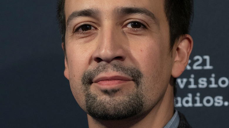 Lin-Manuel Miranda with a neutral expression