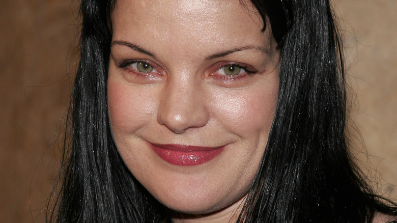 Pauley Perrette smiles at an event