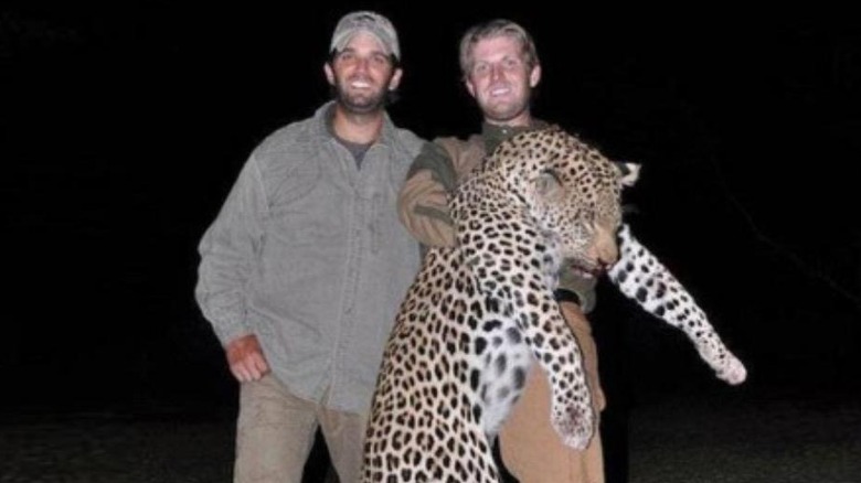 Eric Trump holds a dead leopard