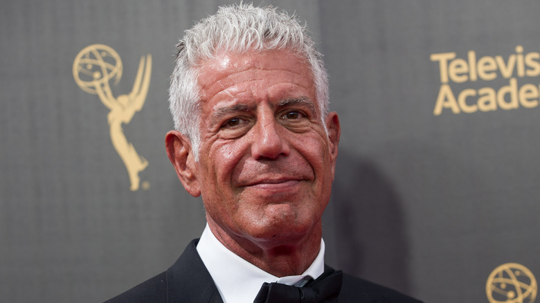 Anthony Bourdain poses in a tux