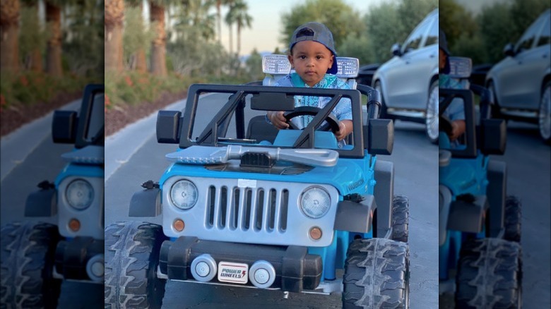 Psalm West driving Power Wheels