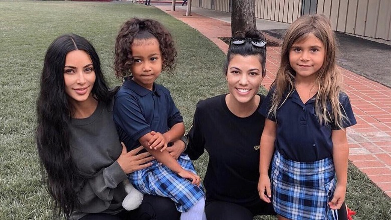 Kim Kardashian and Kourtney Kardashian with kids