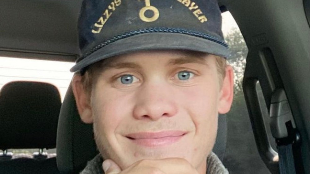 Caleb Drummond posing for selfie in his vehicle