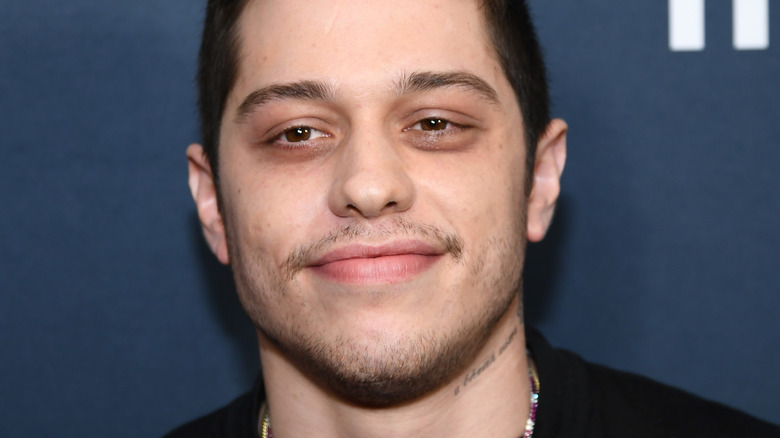 Pete Davidson with slight smile at event
