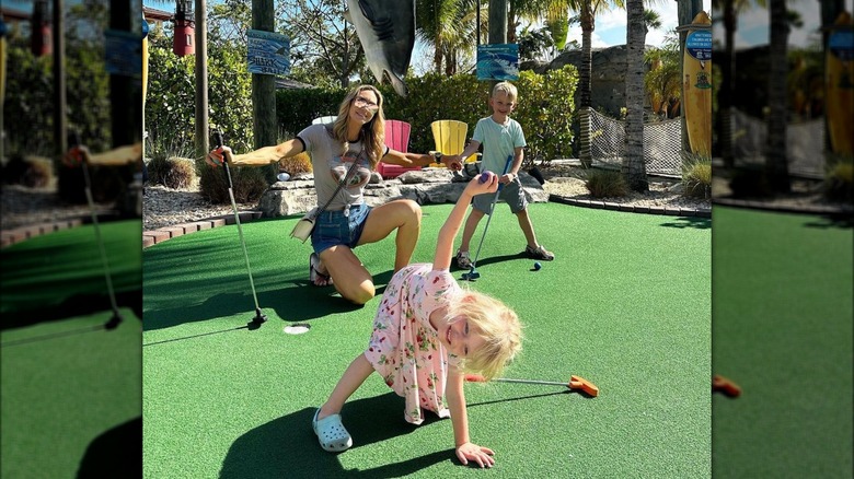 Lara, Luke, and Carolina Trump on mini golf course