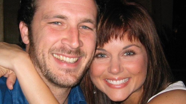 Brady Smith and Tiffani Thiessen smiling