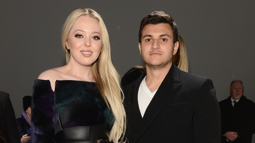 Tiffany Trump and Michael Boulos posing 