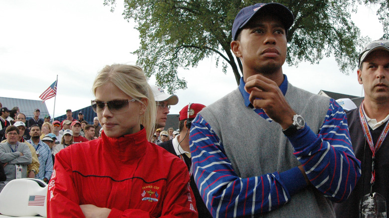 Elin Nordegren and Tiger Woods watching golf