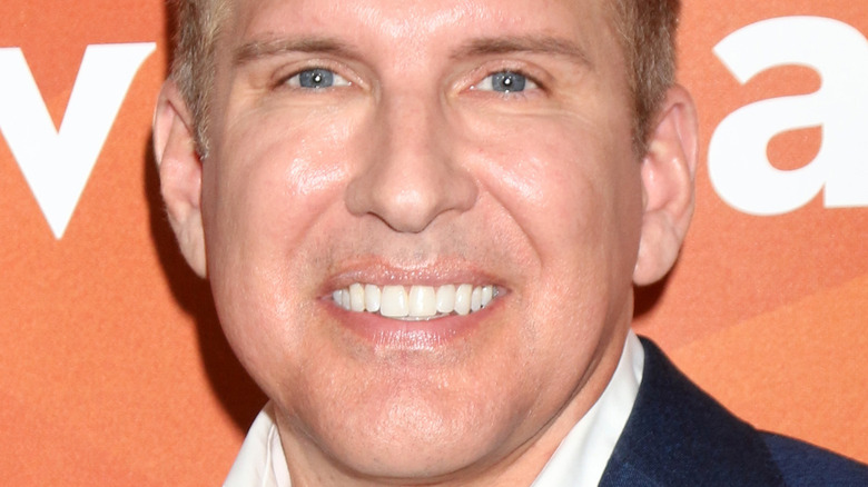 Todd Chrisley smiling at an event