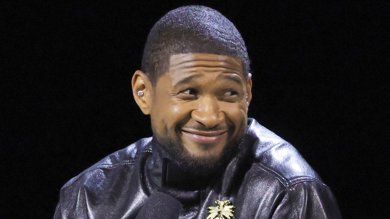 Usher half-smile 