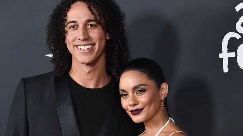 Cole Tucker and Vanessa Hudgens posing together