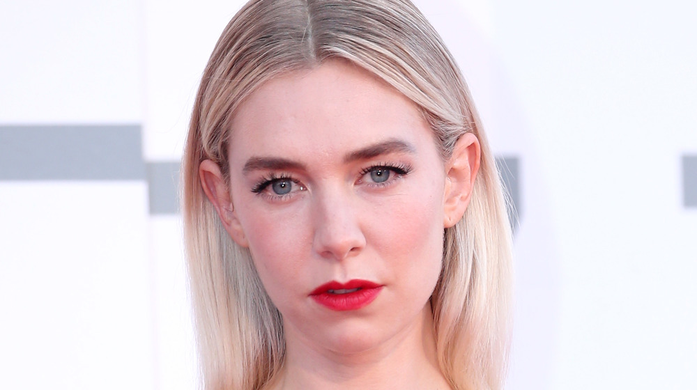 Vanessa Kirby wearing lipstick and her hair straight posing for cameras with a straight face 