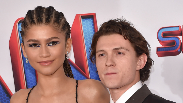 Zendaya and Tom Holland posing