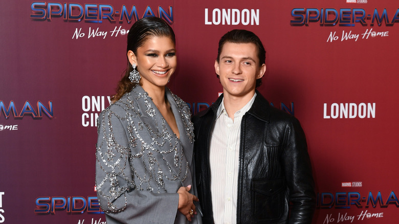Zendaya and Tom Holland grinning
