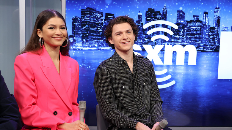 Zendaya and Tom Holland grinning