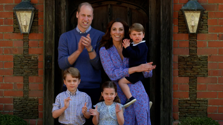 Will and Kate outside with their children