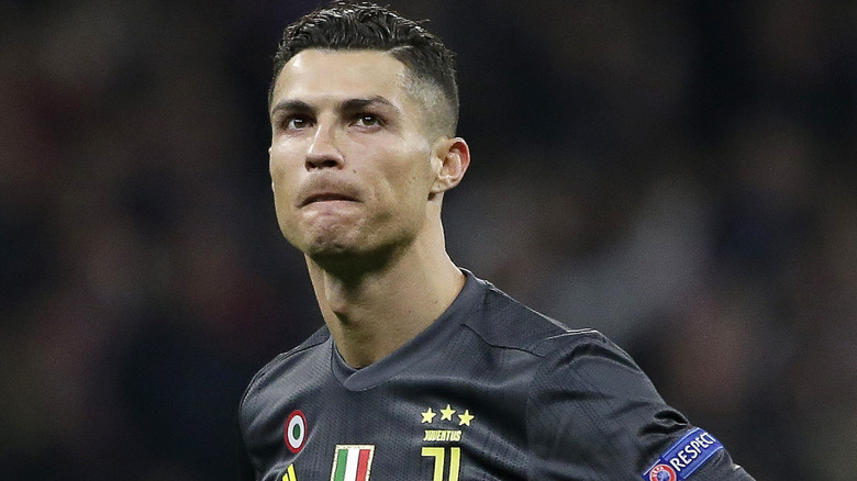 Christiano Ronaldo looking up while on soccer field