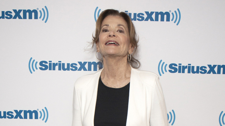 Jessica Walter laughing in front of SiriusXM wall