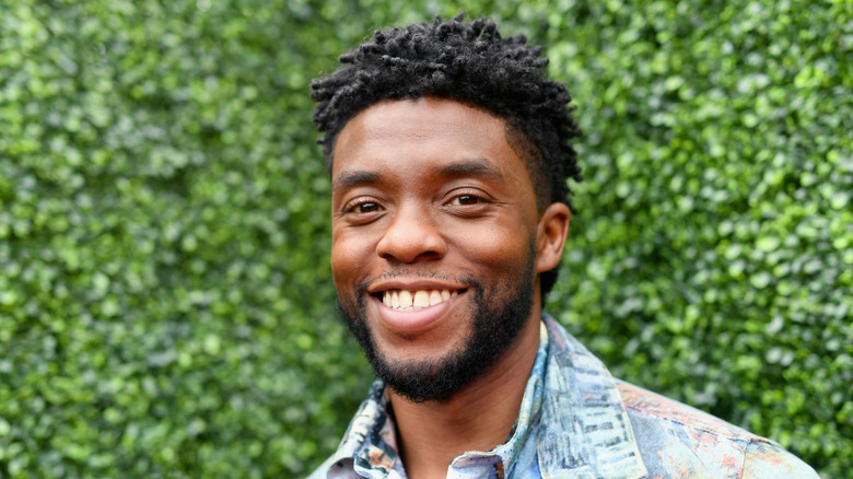 Chadwick Boseman, smiling outside