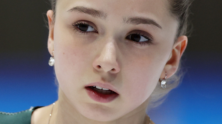 Kamila Valieva looking to the side while skating