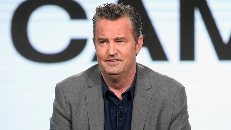 Matthew Perry speaking at an event