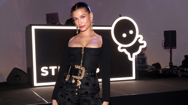 Hailey Bieber posing in black outfit
