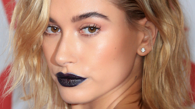 Hailey Bieber wearing bold lipstick