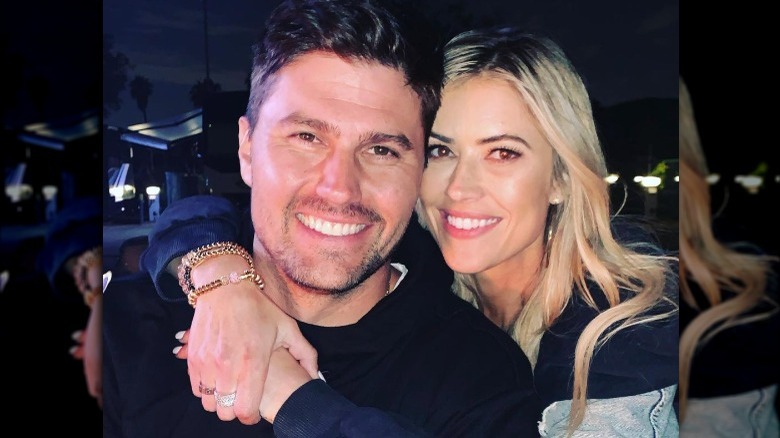 Christina Anstead posing with Josh Hall and his mother