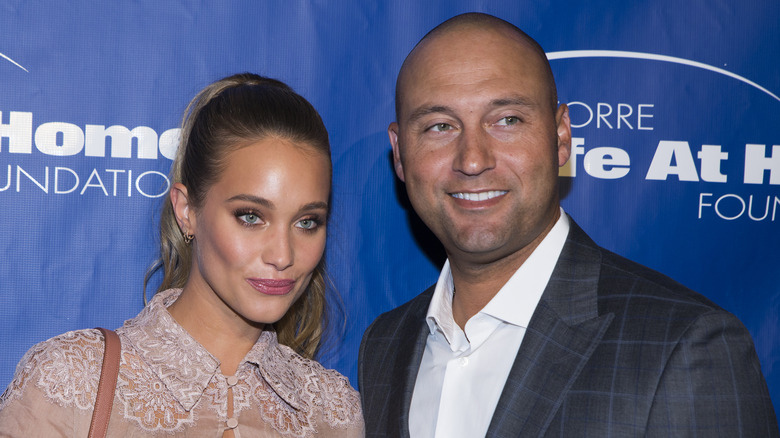 Hannah Jeter and Derek Jeter stand at red carpet event