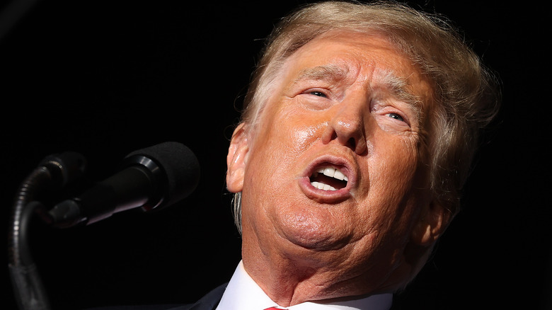 Donald Trump making pained expression while speaking