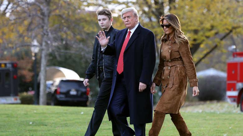 Donald Trump walks with Barron and Melania