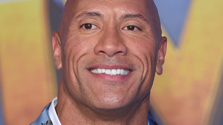 Dwayne Johnson smiling for cameras 