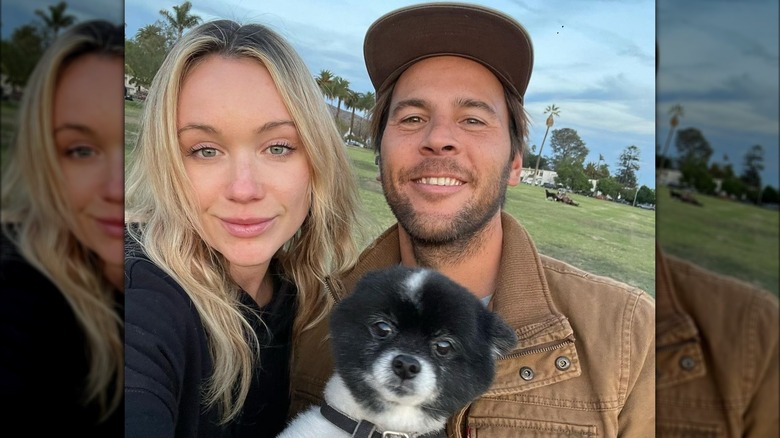 Katrina Bowden, Adam Taylor holding puppy