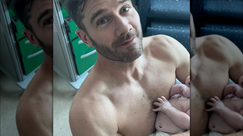 Luke MacFarlane carrying his daughter