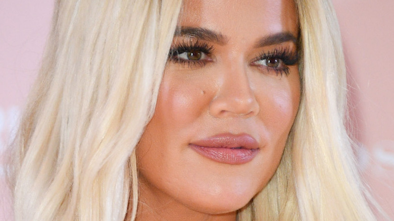 Khloe Kardashian poses with her blond hair down
