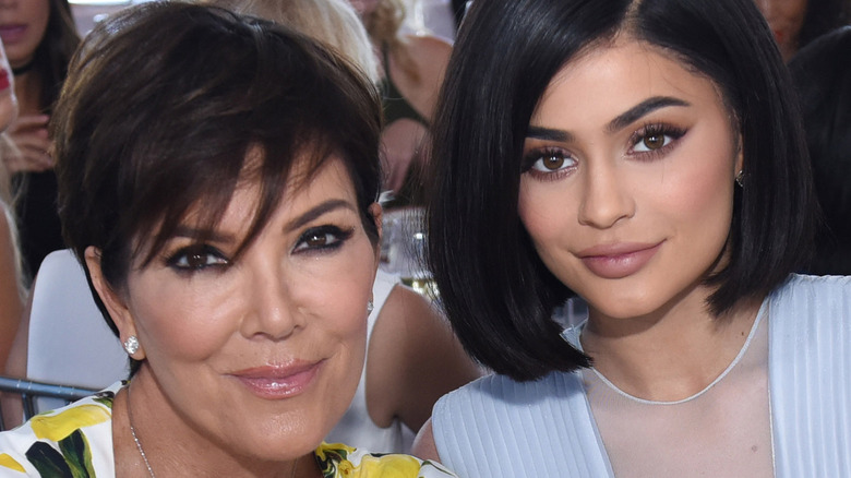 Kris Jenner posing with Kylie Jenner