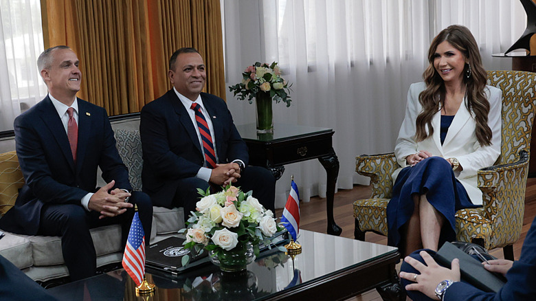 Corey Lewandowski and Kristi Noem at a meeting in Costa Rica.