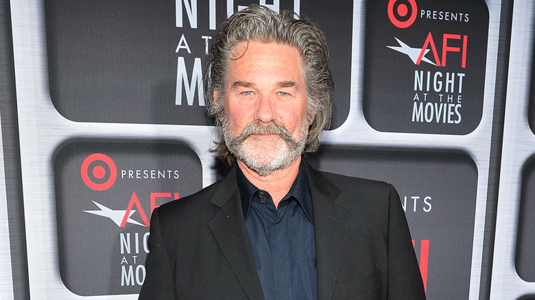 Kurt Russell poses in a mustache in 2013