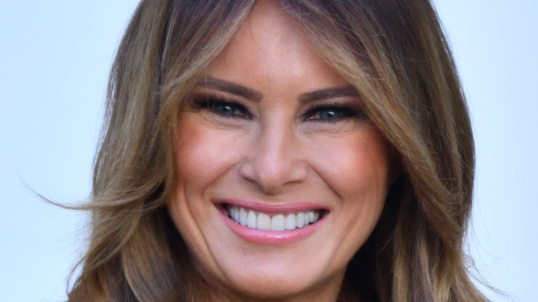 Melania Trump big smile pink lipgloss