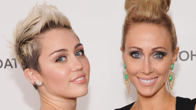 Miley and Tish Cyrus posing