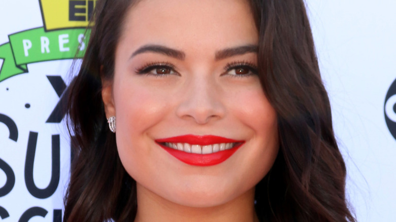 Miranda Cosgrove sports red lipstick