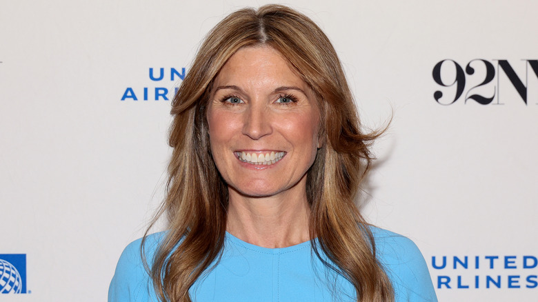 Nicolle Wallace smiling in blue shirt