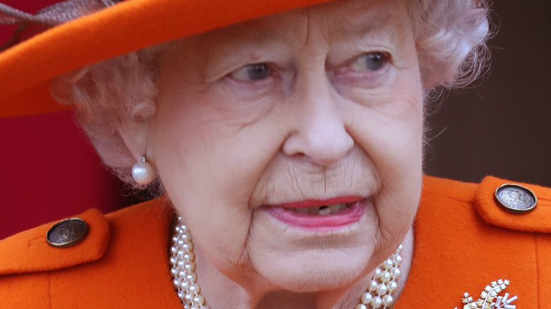 Queen Elizabeth reacts to something at an event