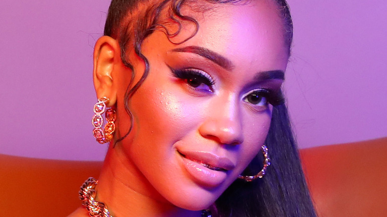 Saweetie wearing hoop earrings