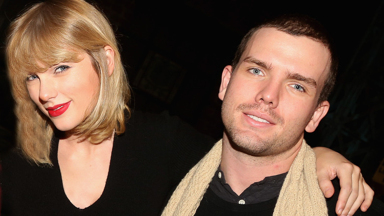 Taylor Swift and Austin Swift smiling